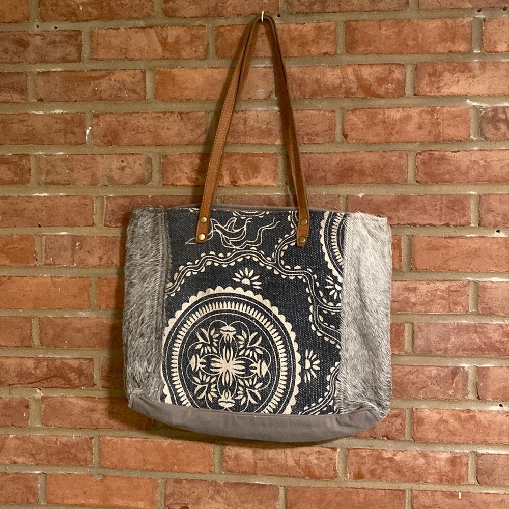 Myra Bag so cute! Leather straps, blue medallion design and gray fur